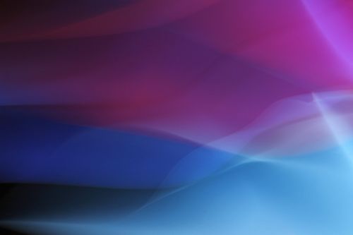 Free Vibrant abstract image depicting fluid waves of color in pinks and blues. Stock Photo