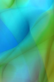 Abstract image of vibrant overlapping waves in green and blue hues, creating a dynamic flow.
