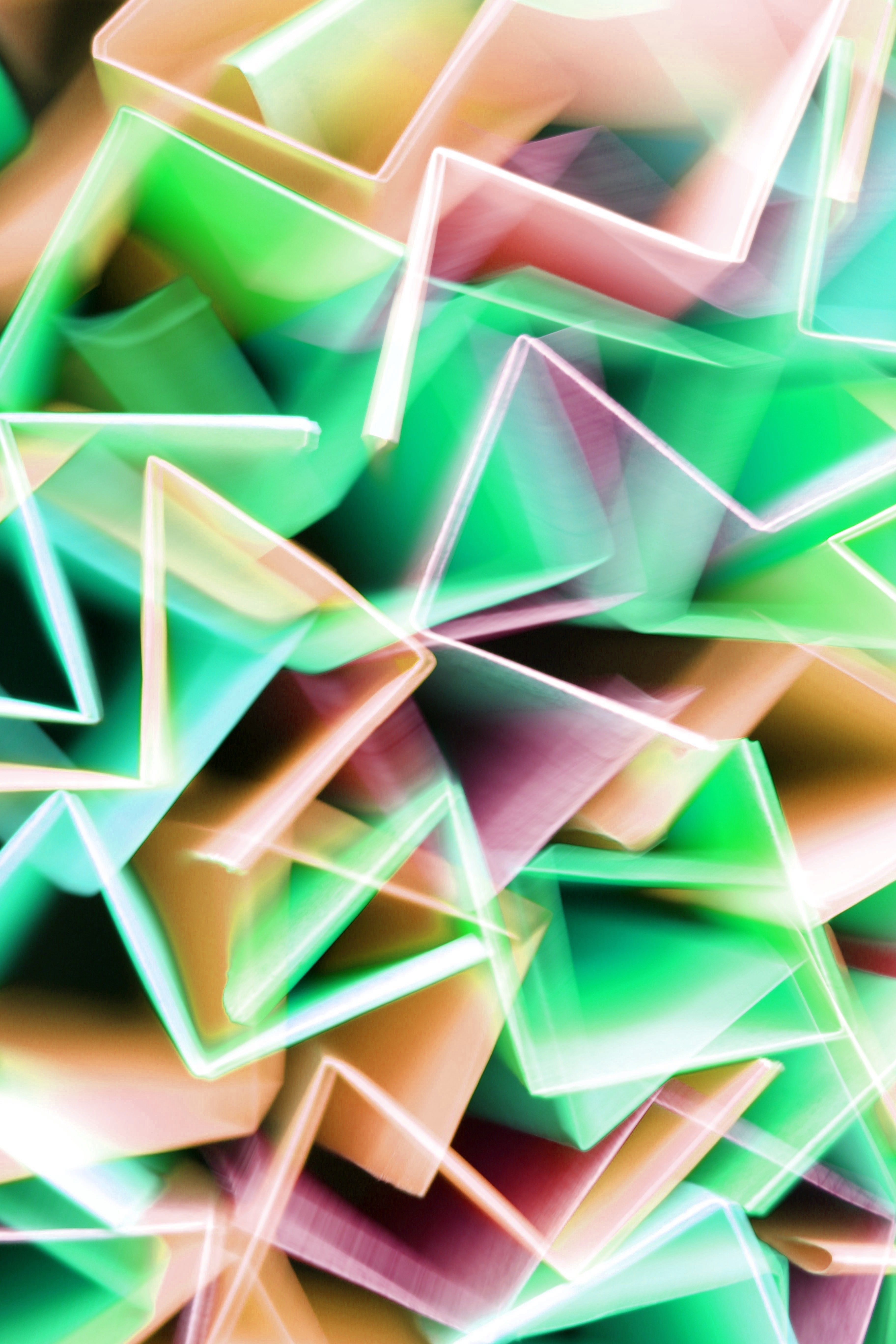 Colorful abstract geometric pattern with vibrant folded shapes. Artistic and dynamic composition.