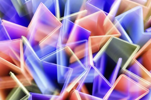 Free Vibrant abstract image featuring dynamic geometric light patterns in various colors. Stock Photo