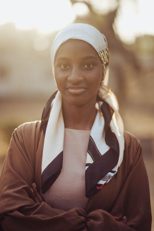 Free Elegant portrait of a woman in traditional attire captured during golden hour. Stock Photo