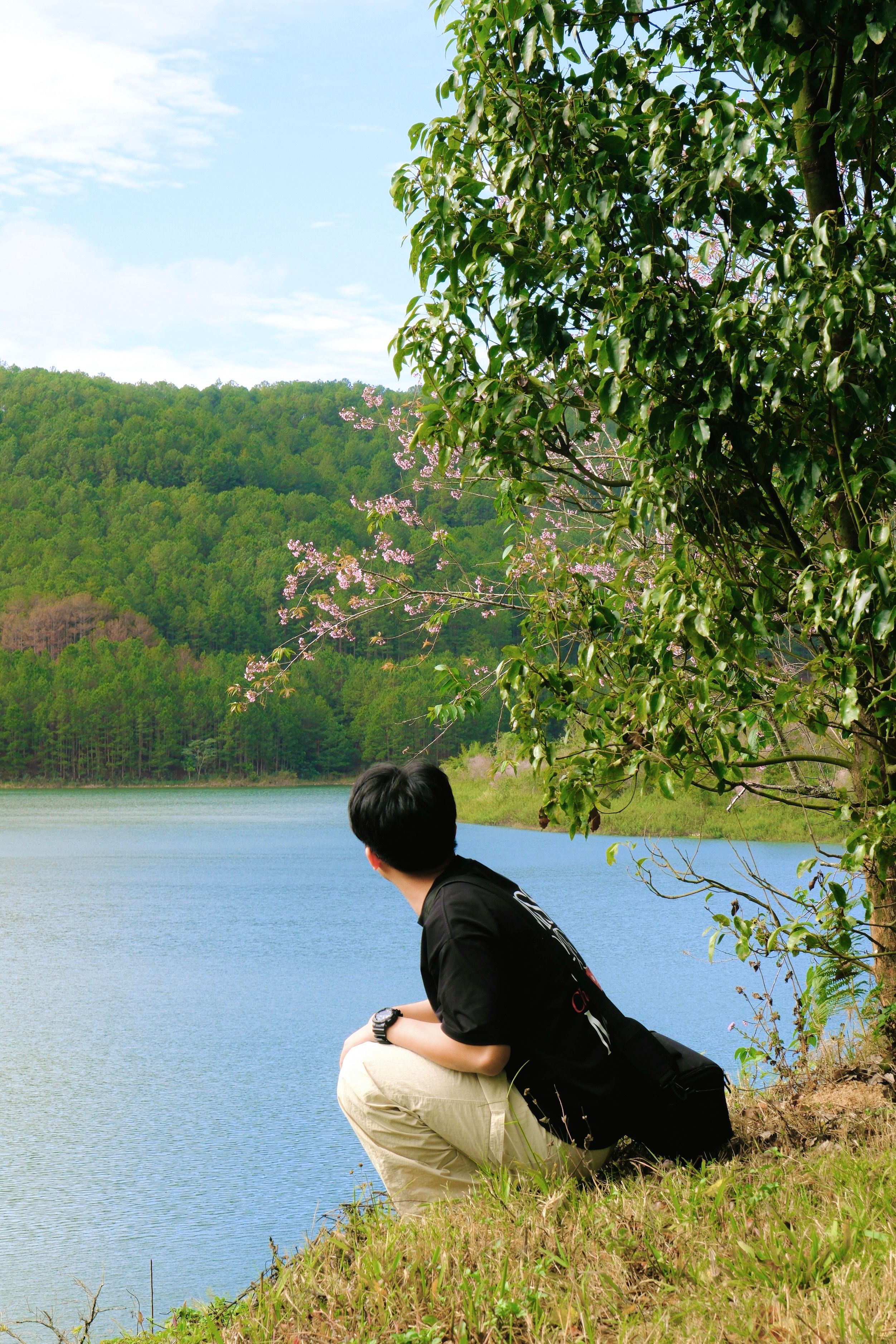 Man Enjoying Scenic Lake View Outdoors · Free Stock Photo