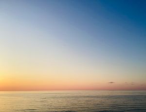 Golden hour over water, photo by Marianna Sigov on Pexels