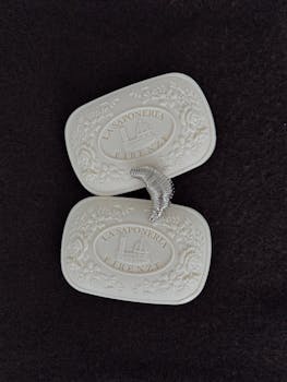 Close-up of artisan embossed soap from Florence displayed on dark background.