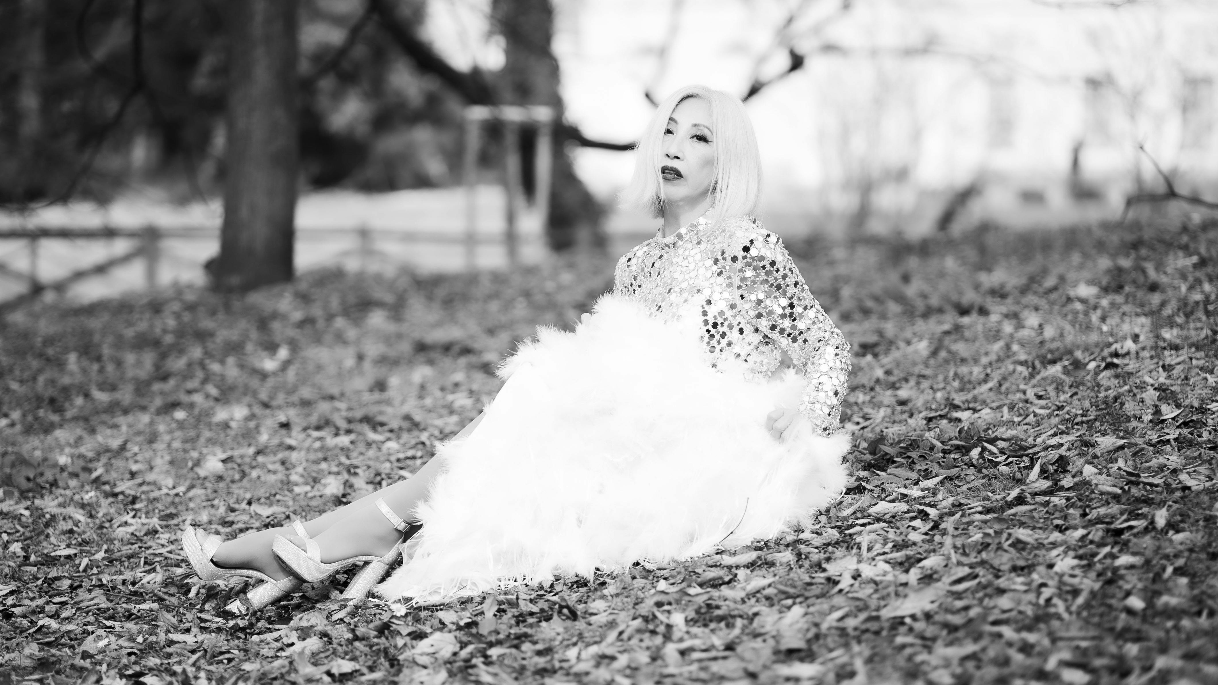 Stylish woman in sequined dress on a fall day in Milan, Italy.