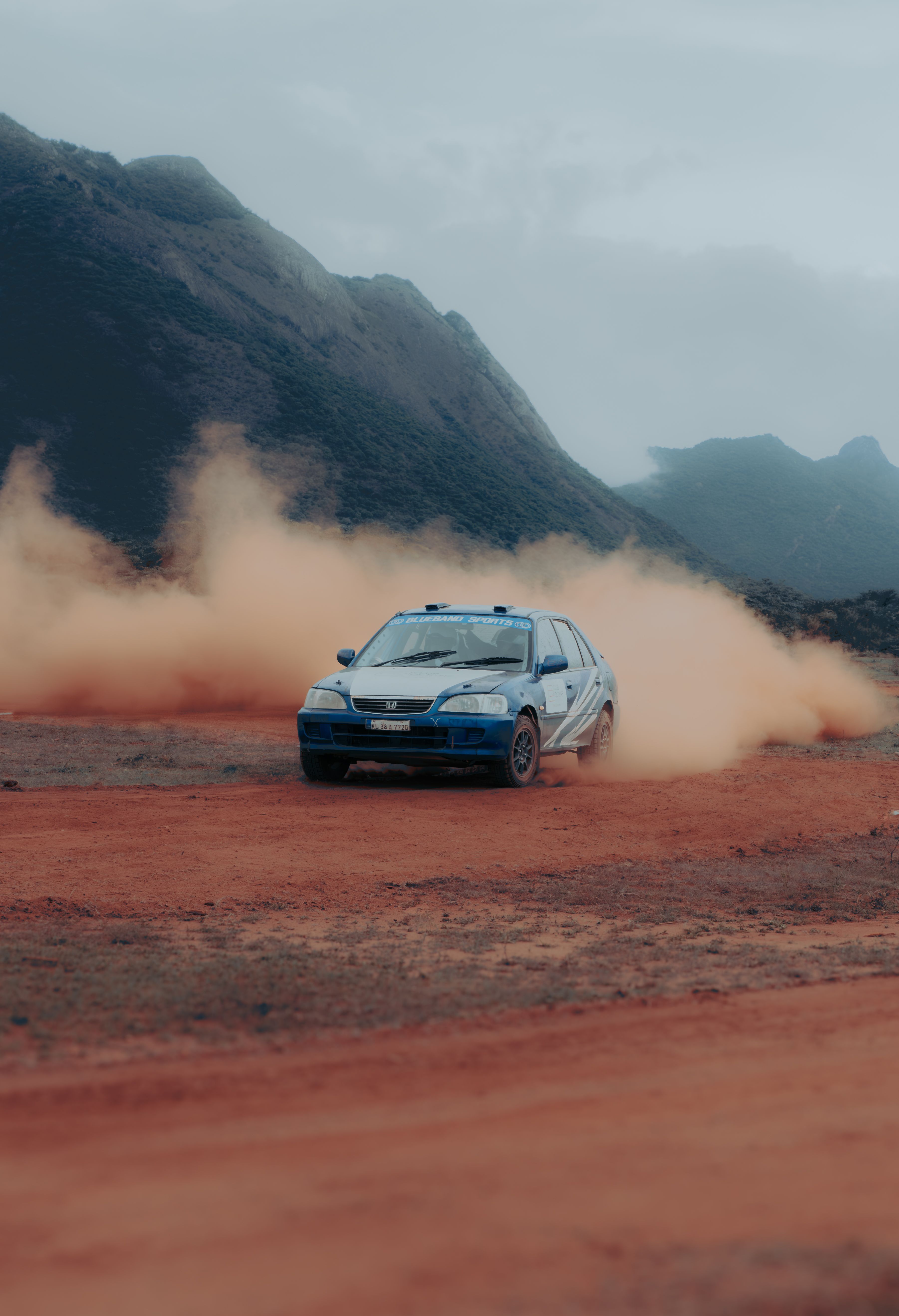 Rally Car Racing on Dirt Track in Desert · Free Stock Photo