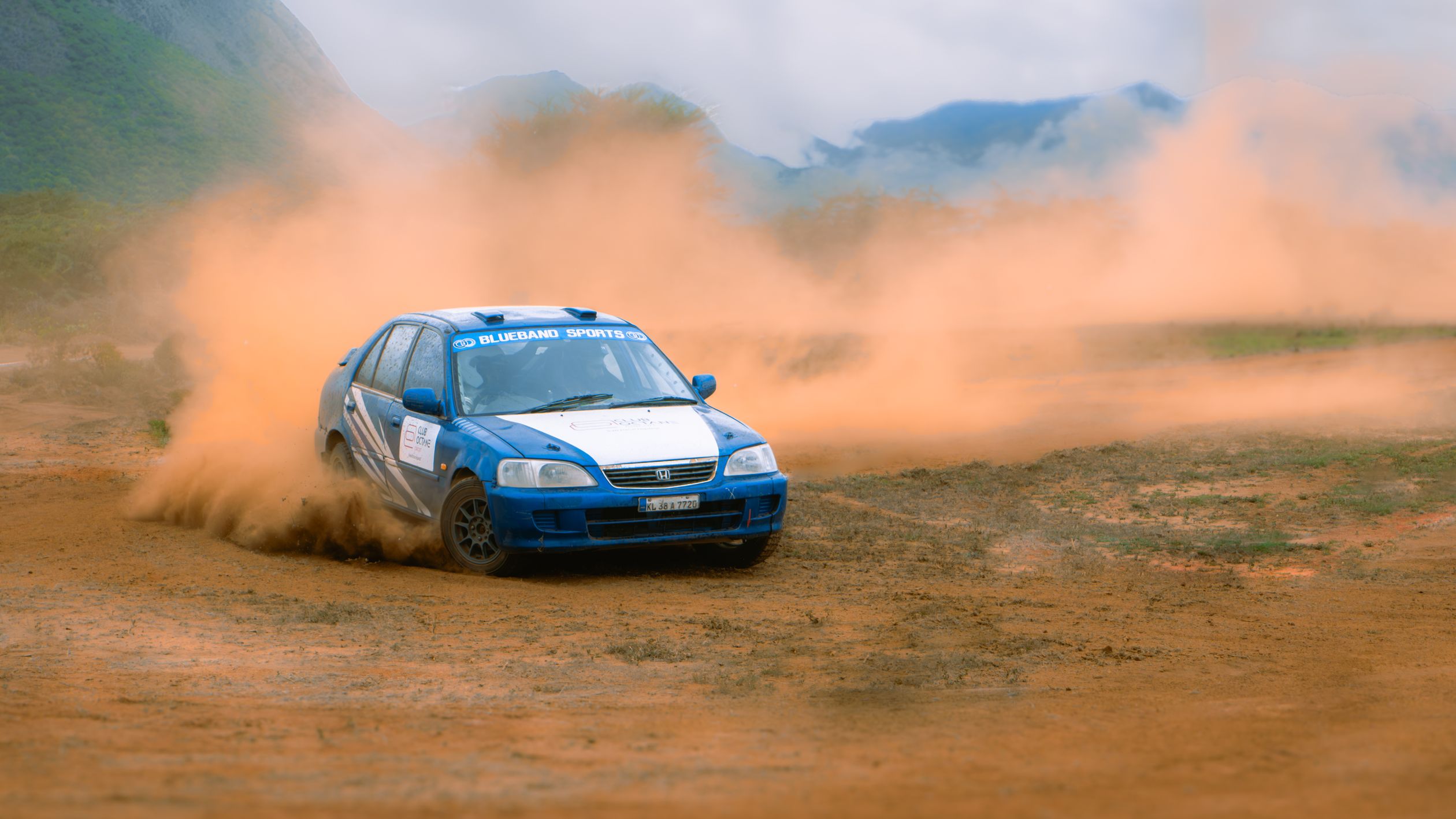Rally Car Racing on Dirt Track in Desert · Free Stock Photo