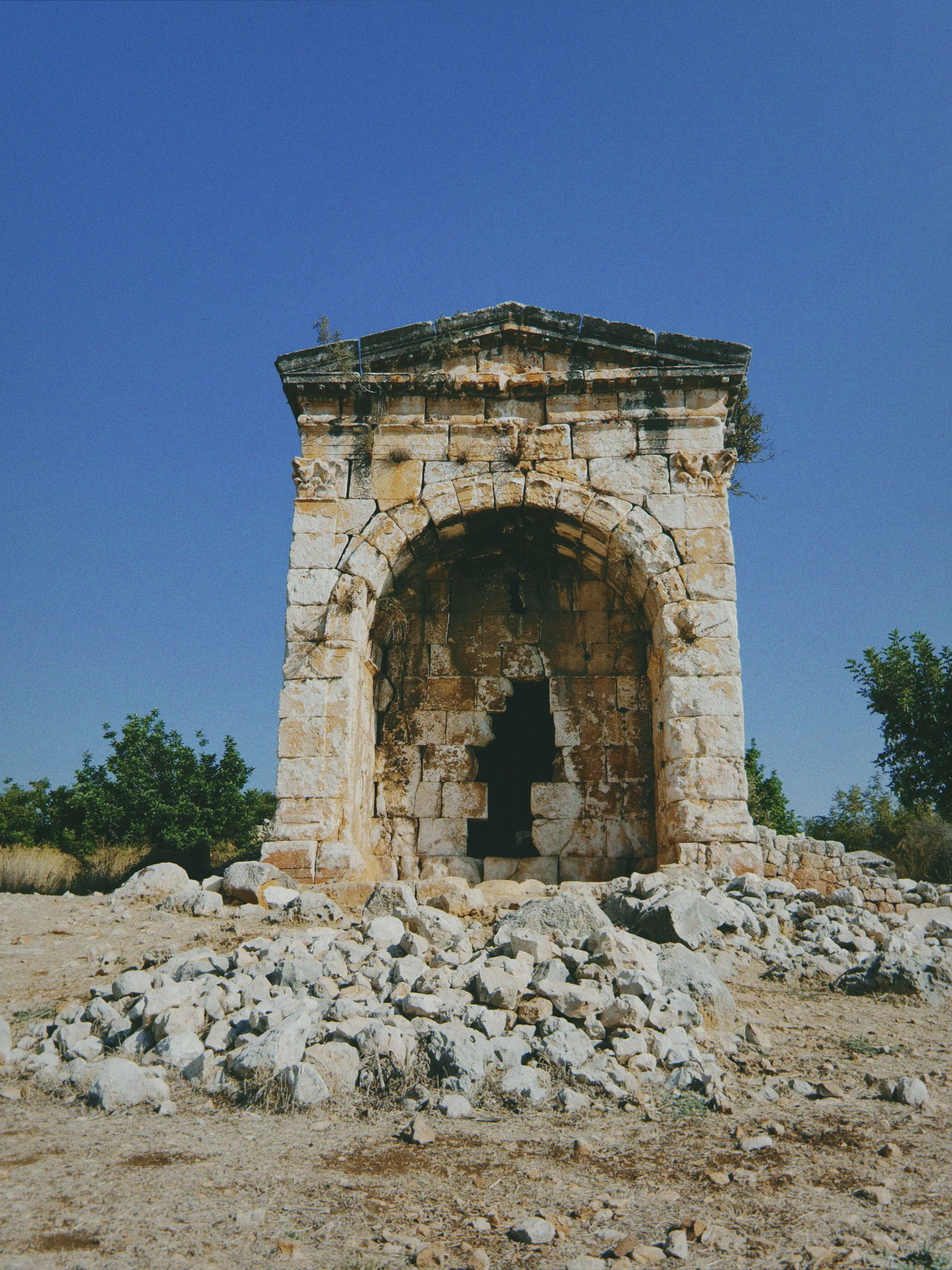Ancient Stone Ruin Under Clear Blue Sky · Free Stock Photo
