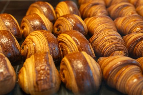 Free Delicious freshly baked chocolate croissants on display in a Berlin bakery, perfect for breakfast. Stock Photo