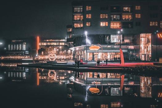 Cinematic nighttime cityscape reflecting on water in Jönköping, Sweden.