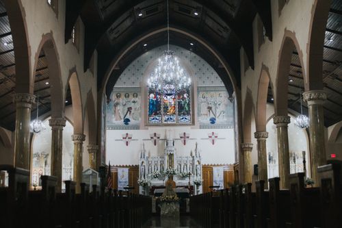 Free Intricate interior of a historic church with stunning stained glass, arches, and chandeliers. Stock Photo