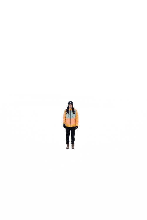 Free A lone traveler in winter attire stands amid the vast Uyuni Salt Flats in Bolivia. Stock Photo
