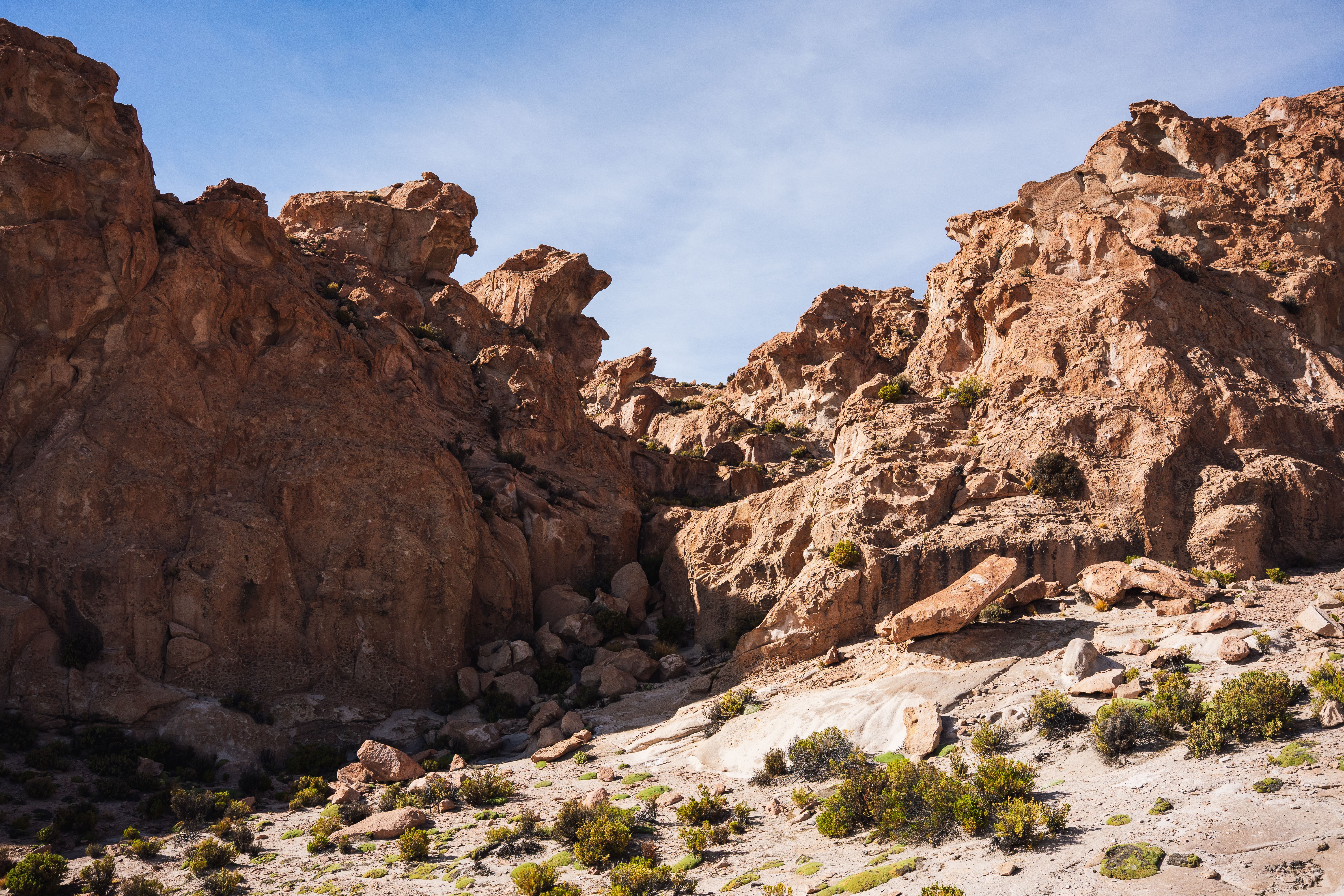 Explore the rugged and dramatic rock formations in Uyuni, Bolivia's striking landscape.