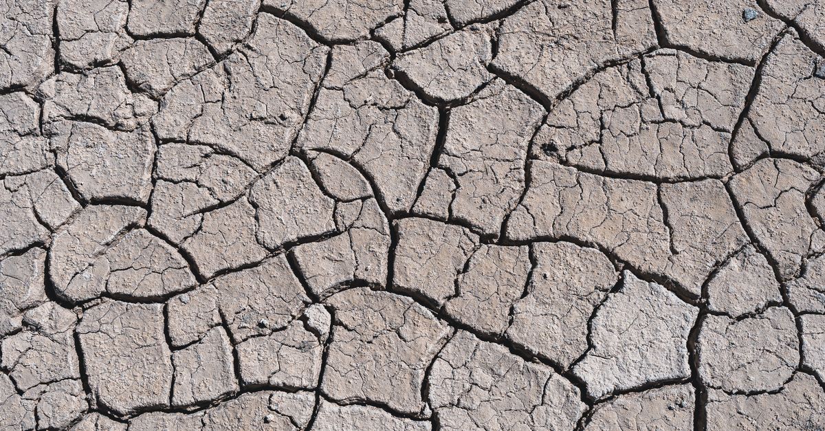 aerial view of dried reservoir cracked earth drought