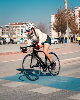 Cyclist competing in a race on the streets of Konya, Türkiye on a sunny day.