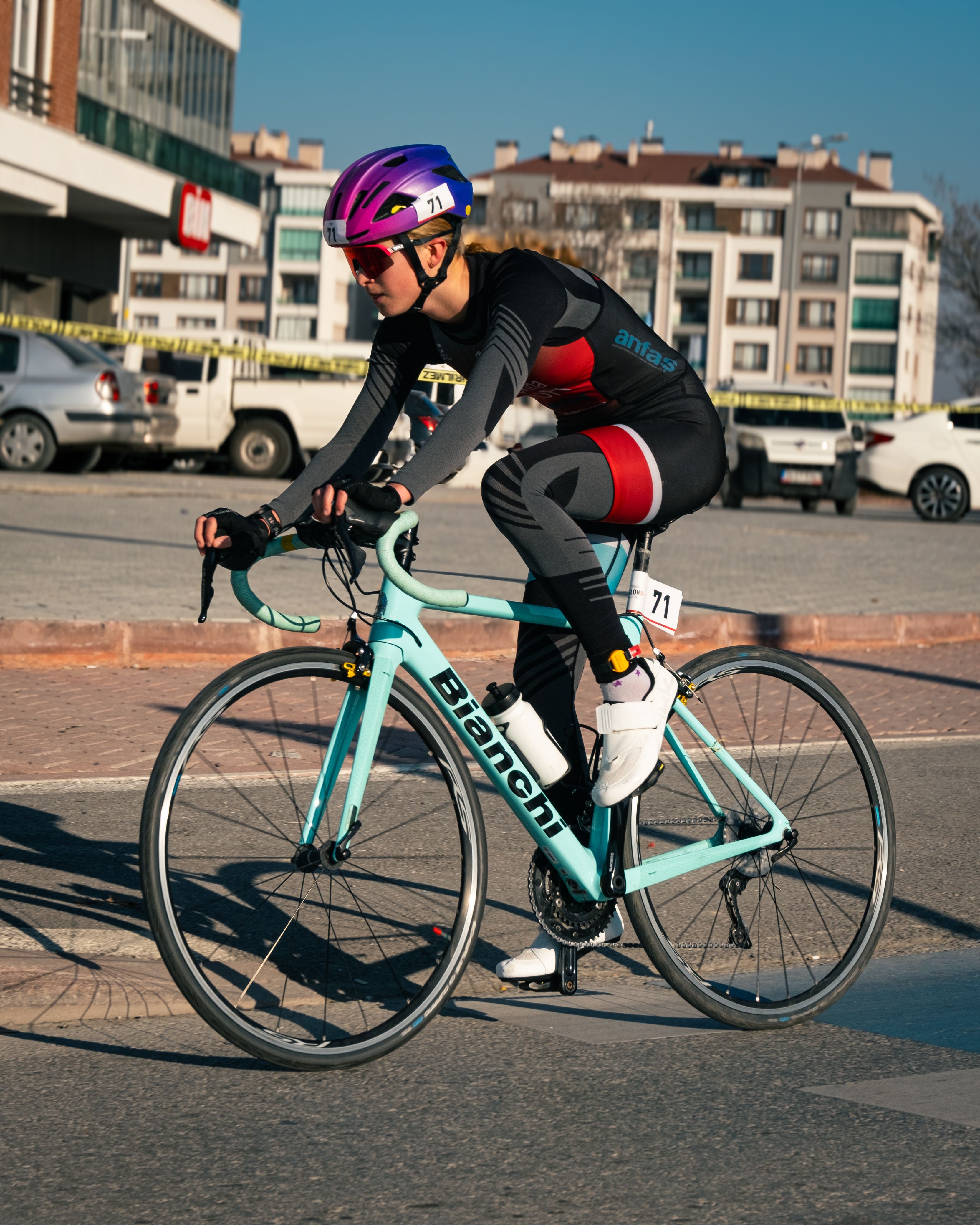 Cyclist competing in a vibrant outdoor race in Konya, Türkiye.