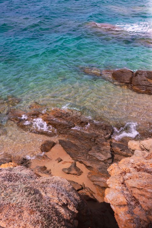 Free The stunning azure coastline of Naxos, Greece, captured in vibrant summer hues. Stock Photo