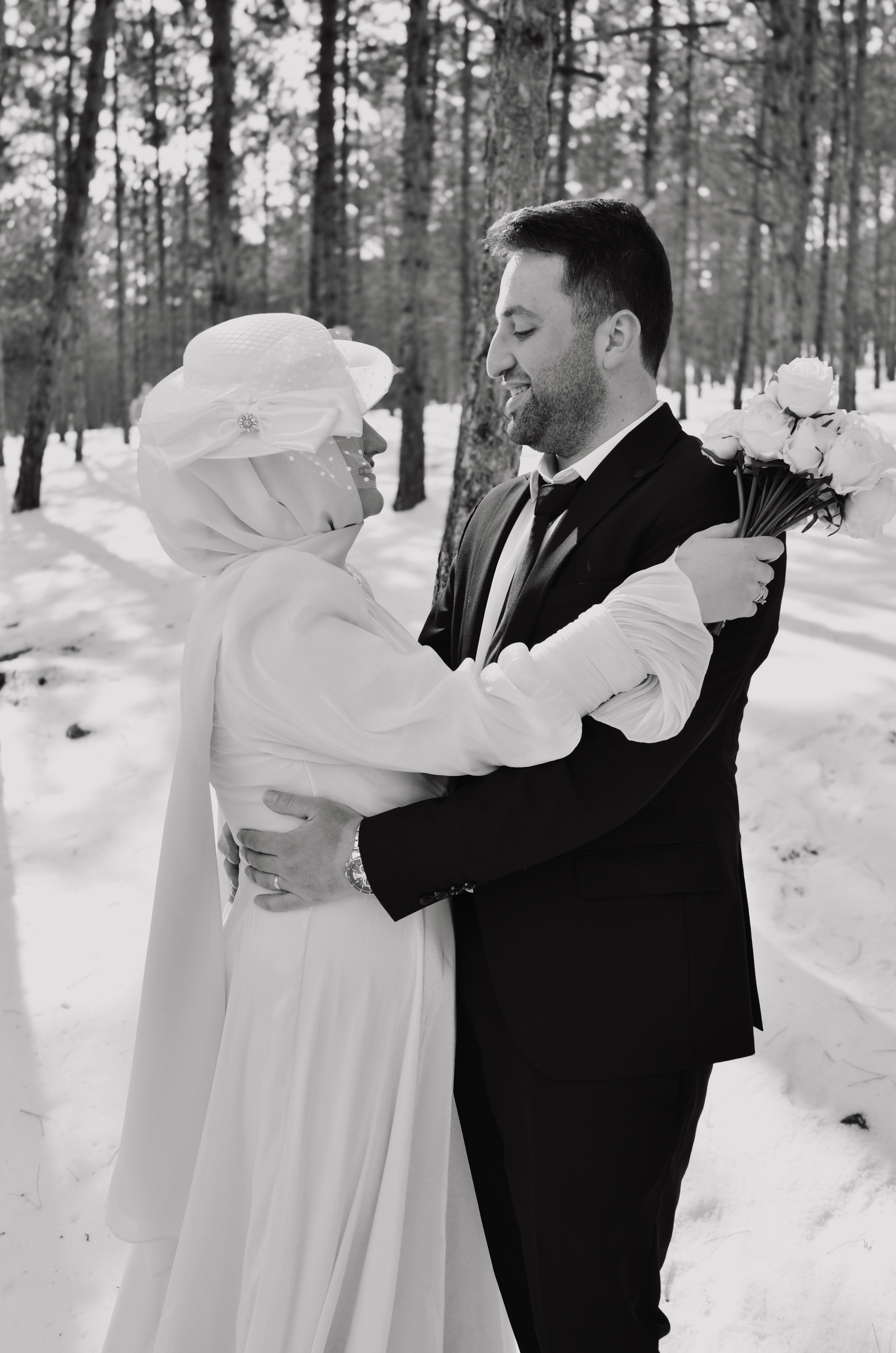 Winter wedding couple embracing outdoors