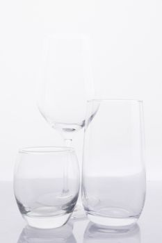 Elegant arrangement of various glassware against a clean white backdrop.