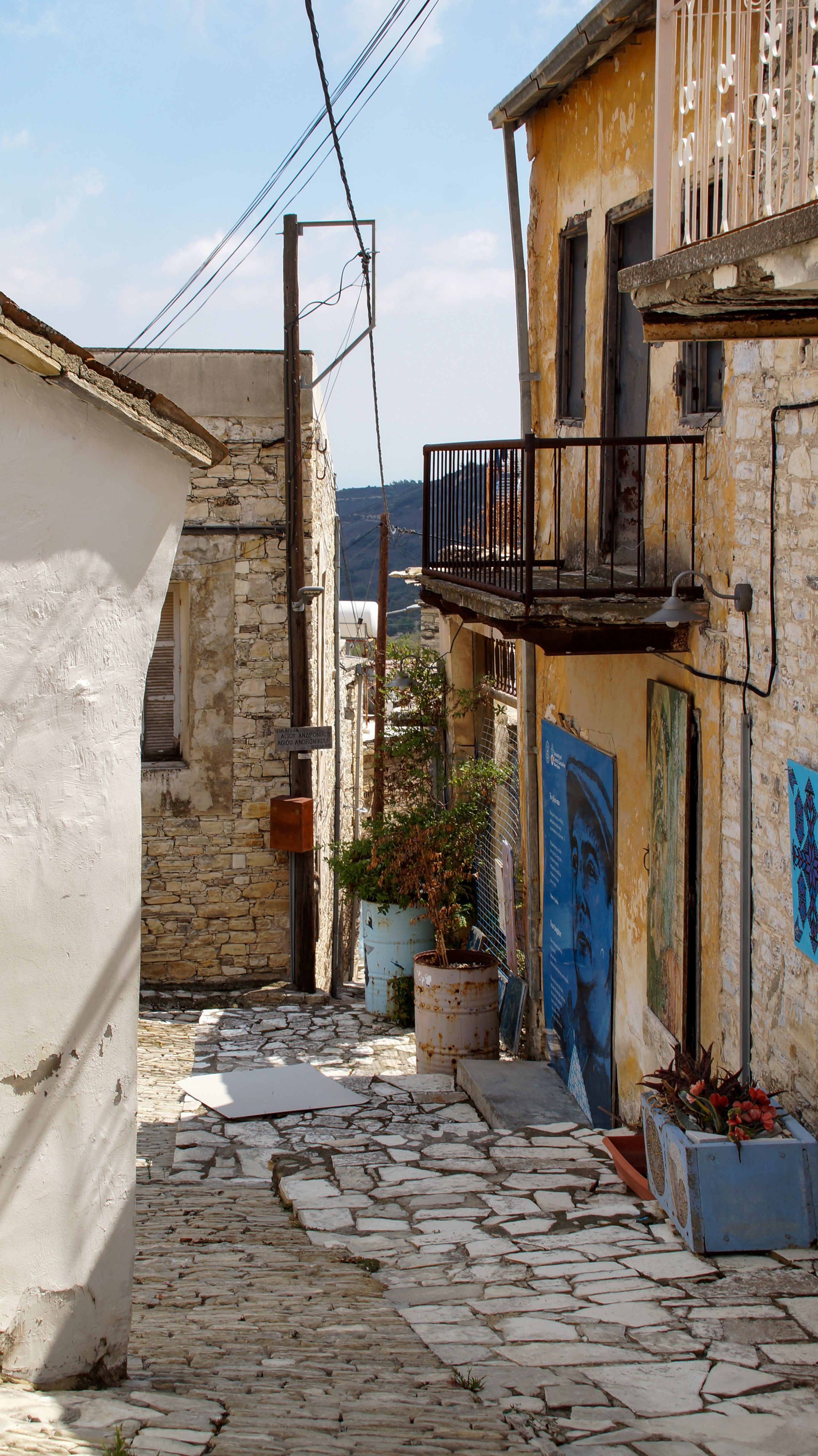 Charming rustic street in Cyprus with stone houses and narrow alleys, perfect for tourism and travel themes.