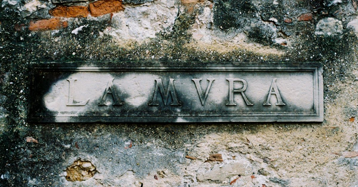 Old Sign Using Stone Weathered Stone Sign on Rustic Wall Outdoors · Free Stock Photo