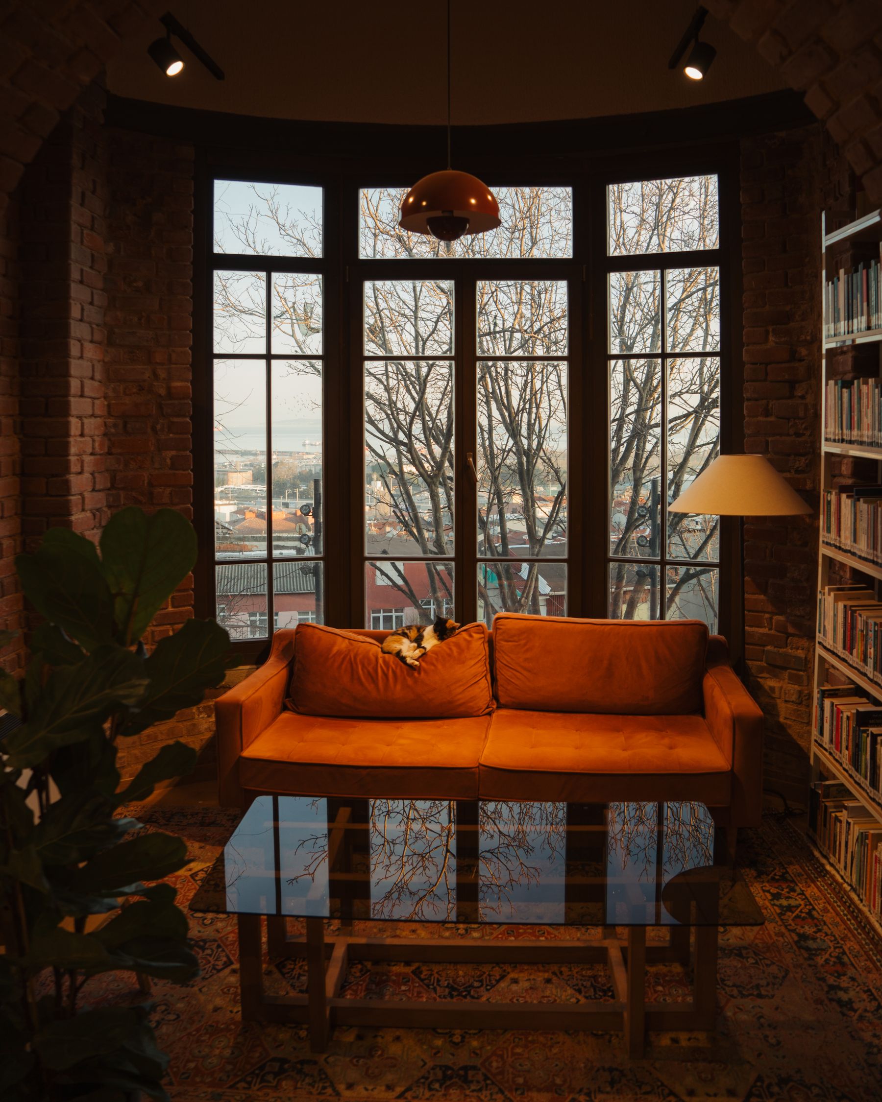 Warm-toned interior beside a cool winter landscape