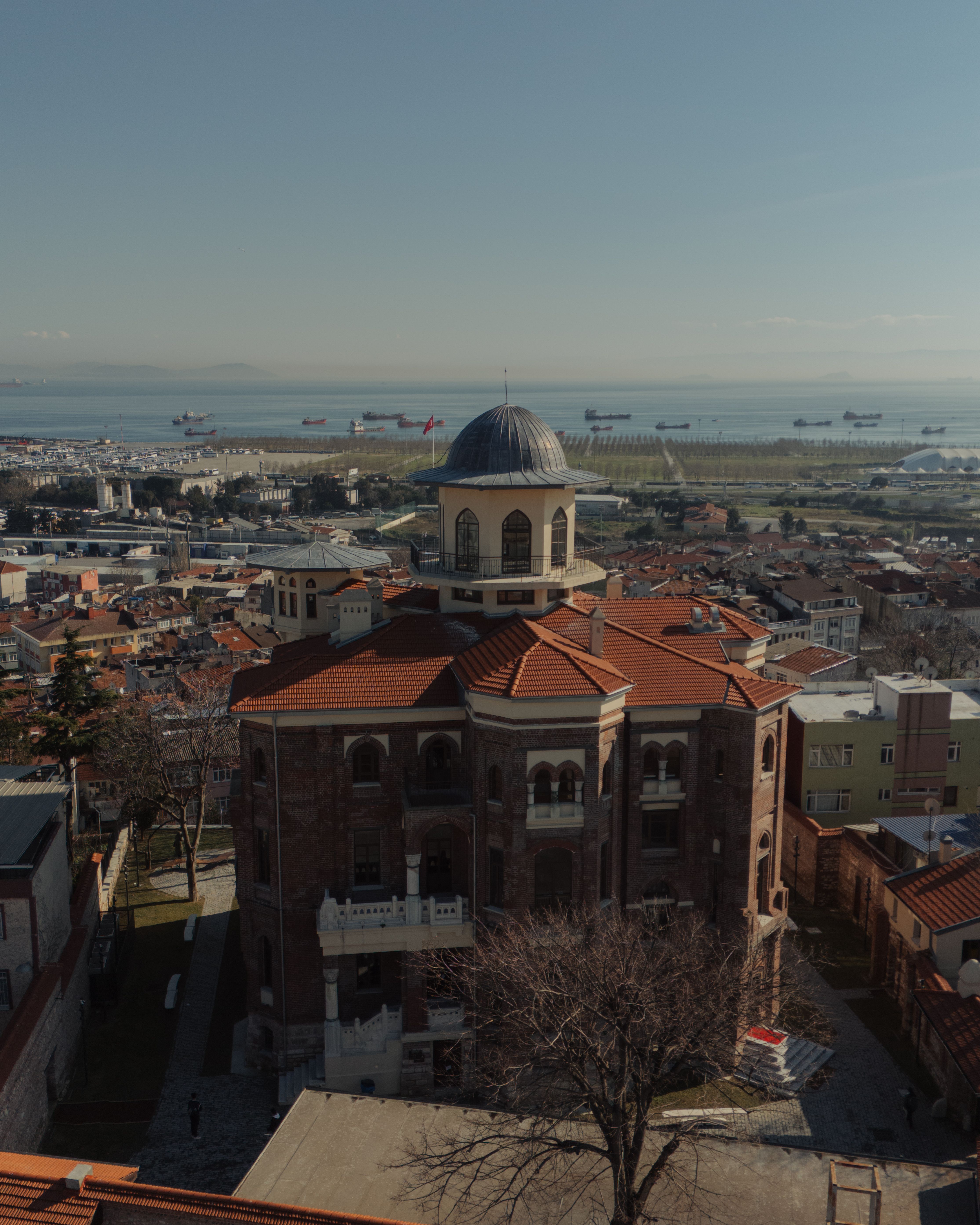 Aerial View of Historic Building by the Sea · Free Stock Photo