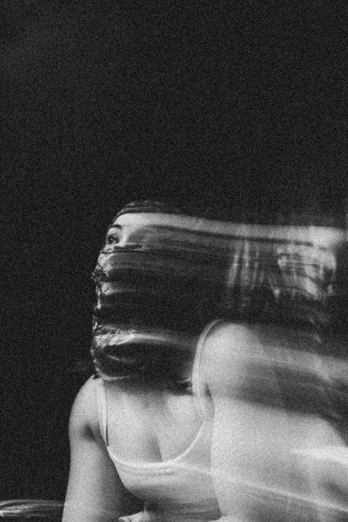 Free Artistic black and white portrait of a woman with motion blur effect. Stock Photo