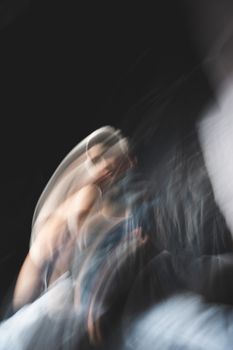 Abstract artistic portrait of a woman captured with motion blur.