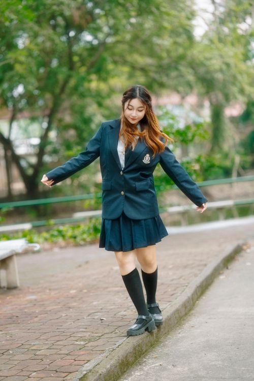 Young Woman in School Uniform Outdoors · Free Stock Photo