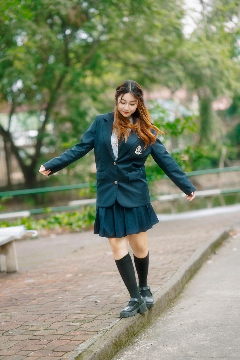 Young Woman in School Uniform Outdoors · Free Stock Photo