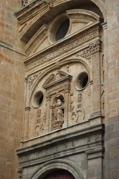 Intricate stone facade of a historical building in Salamanca, Spain.