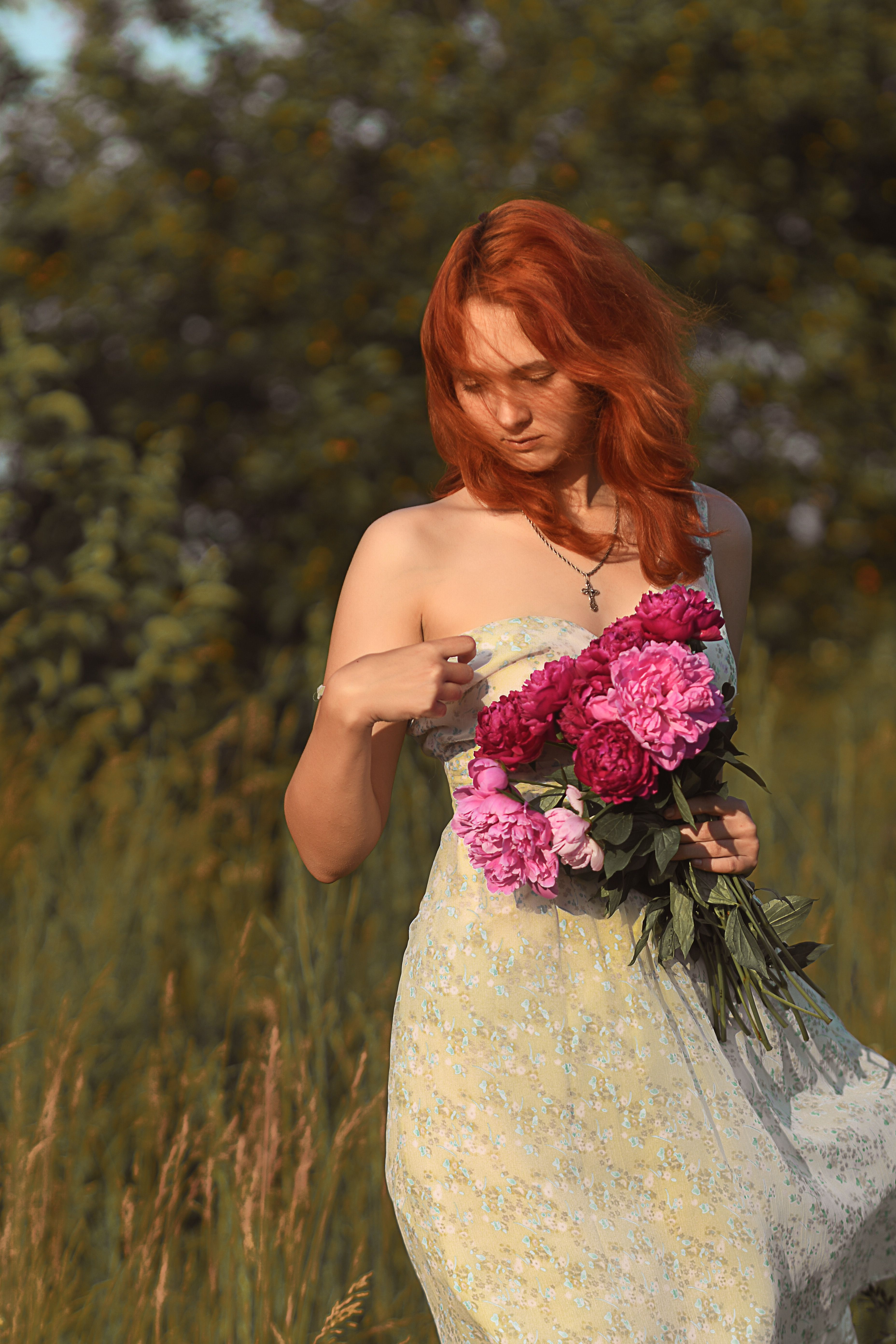 Young Woman Holding Pink Peonies Outdoors · Free Stock Photo