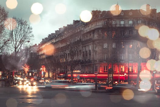 Long exposure of a bustling Paris street with vibrant light trails and bokeh effects. Urban evening scene.