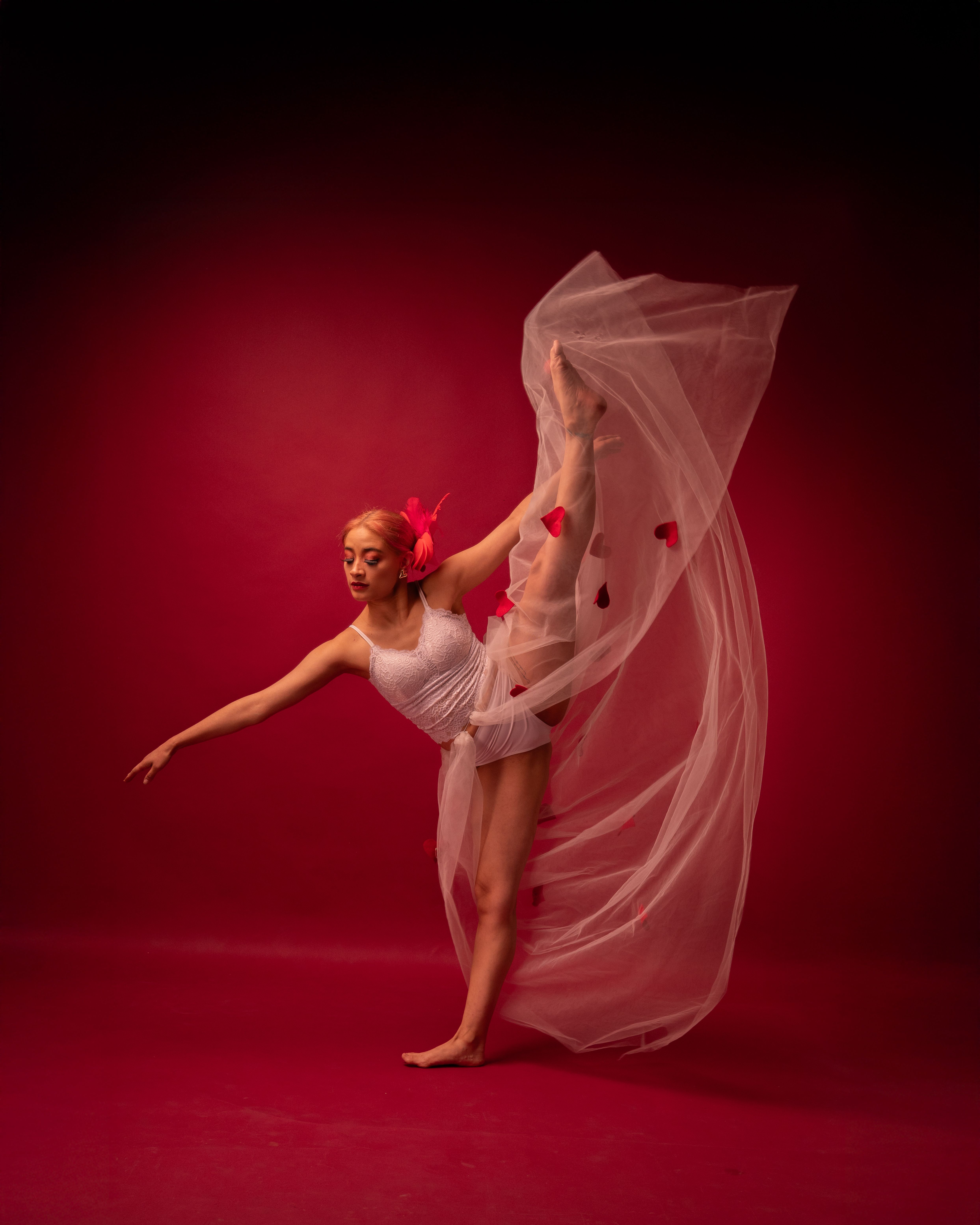 Graceful Ballet Dancer in Red Studio Setting · Free Stock Photo