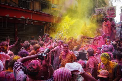 Free Colorful Holi festival celebration with people covered in powders in Kolkata, India. Stock Photo