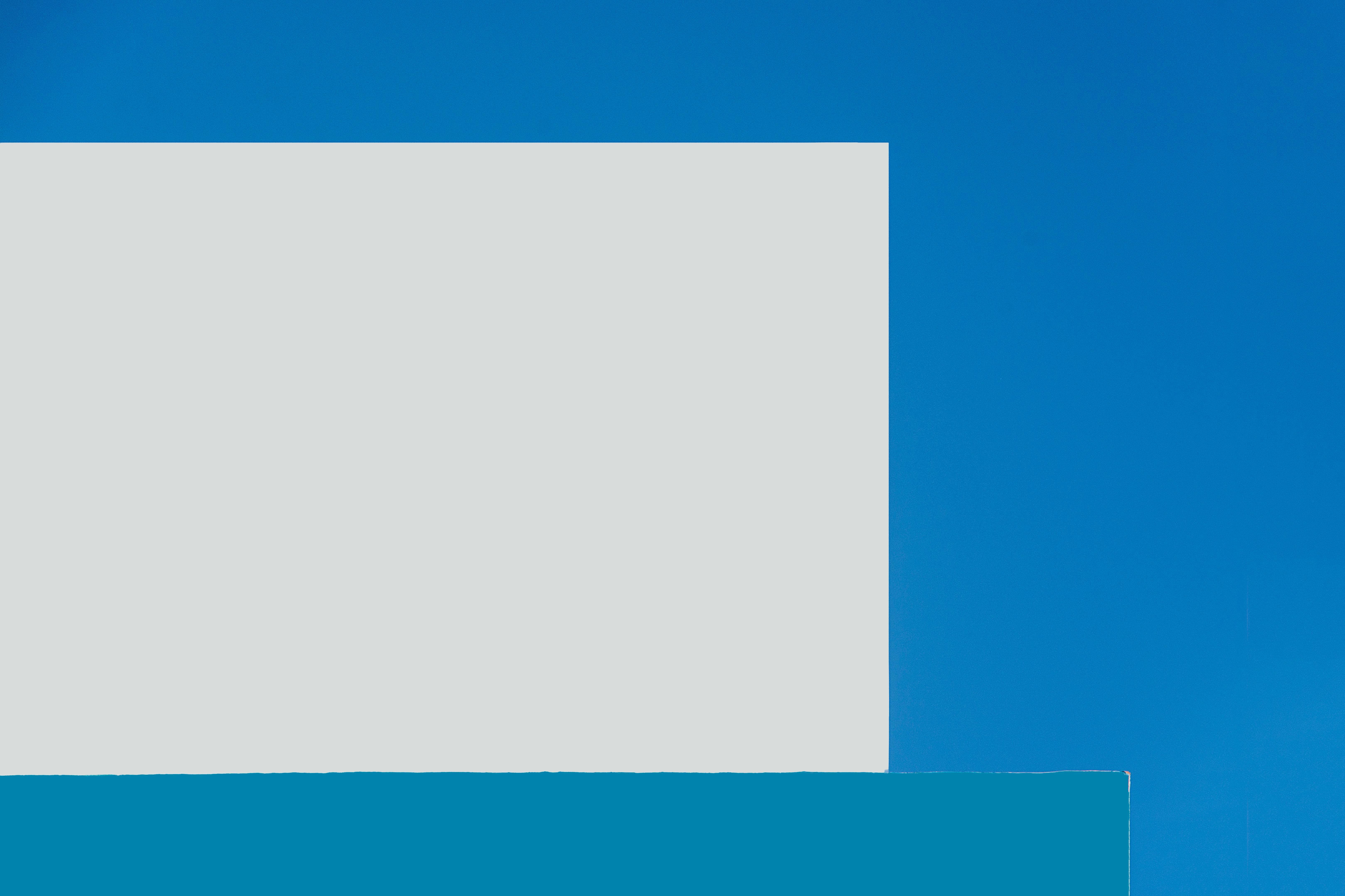 Free Abstract composition featuring geometric shapes and bold blue tones in a minimalist style. Stock Photo