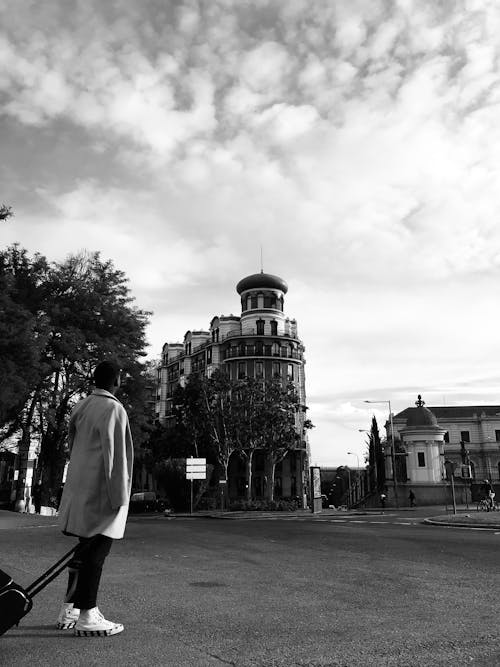 Man Looking At A Historic Building