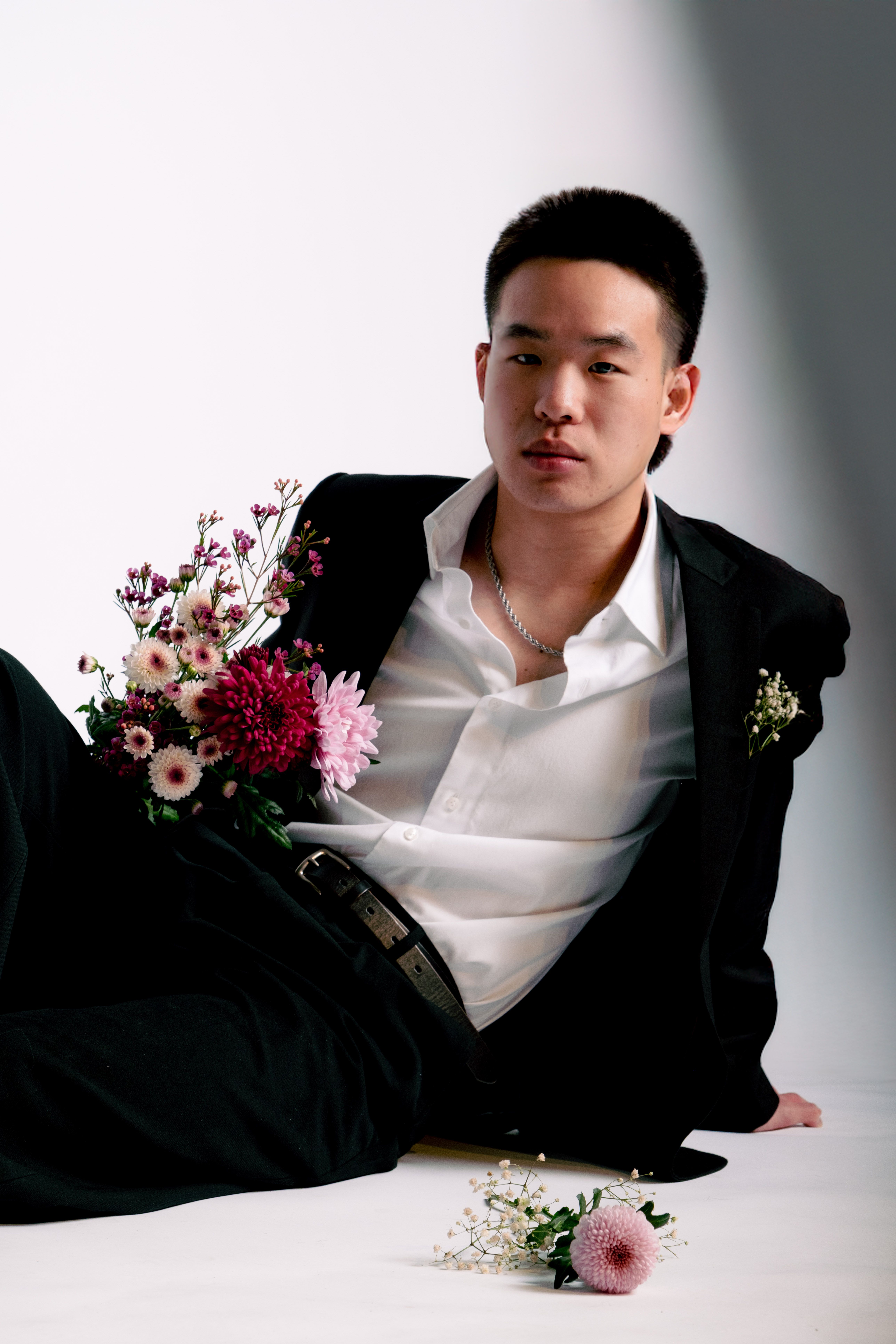 Elegant Floral Portrait of a Man in a Suit · Free Stock Photo
