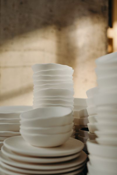 Stacked white ceramics — cottonbro studio on Pexels