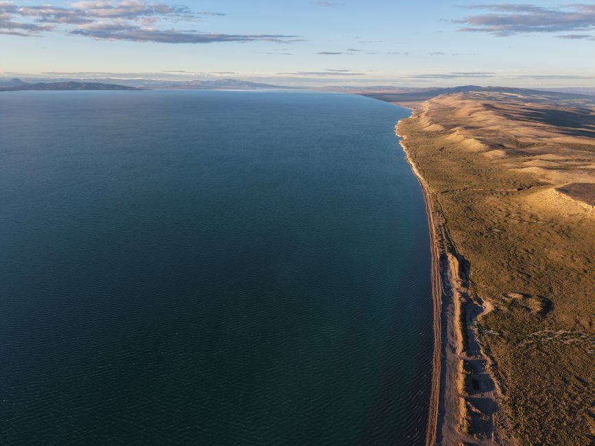 Unbeatable Flight by Helicopter - Great Lakes - A1hs Review: Soaring Over Tierra del Fuego's Spectacular Landscapes Review 2026 - Breathtaking aerial shot of Chubut's coastal landscape, showcasing serene waters and rugged terrain.