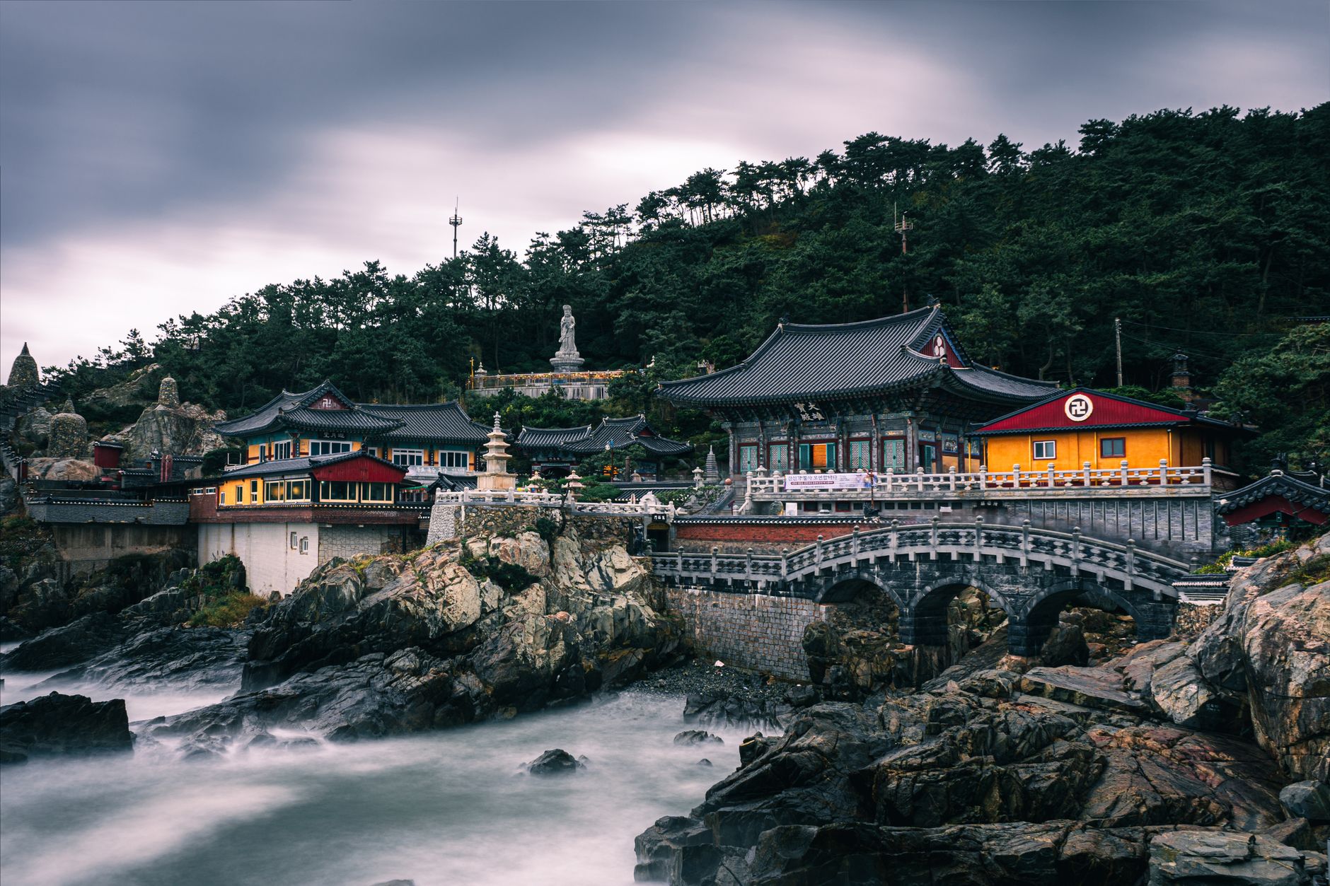 Haedong Yonggungsa Temple nestled along the rocky coastline in Busan, South Korea.