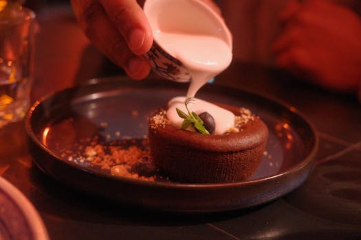 Decadent chocolate cake drizzled with coconut cream, perfect for dessert lovers.