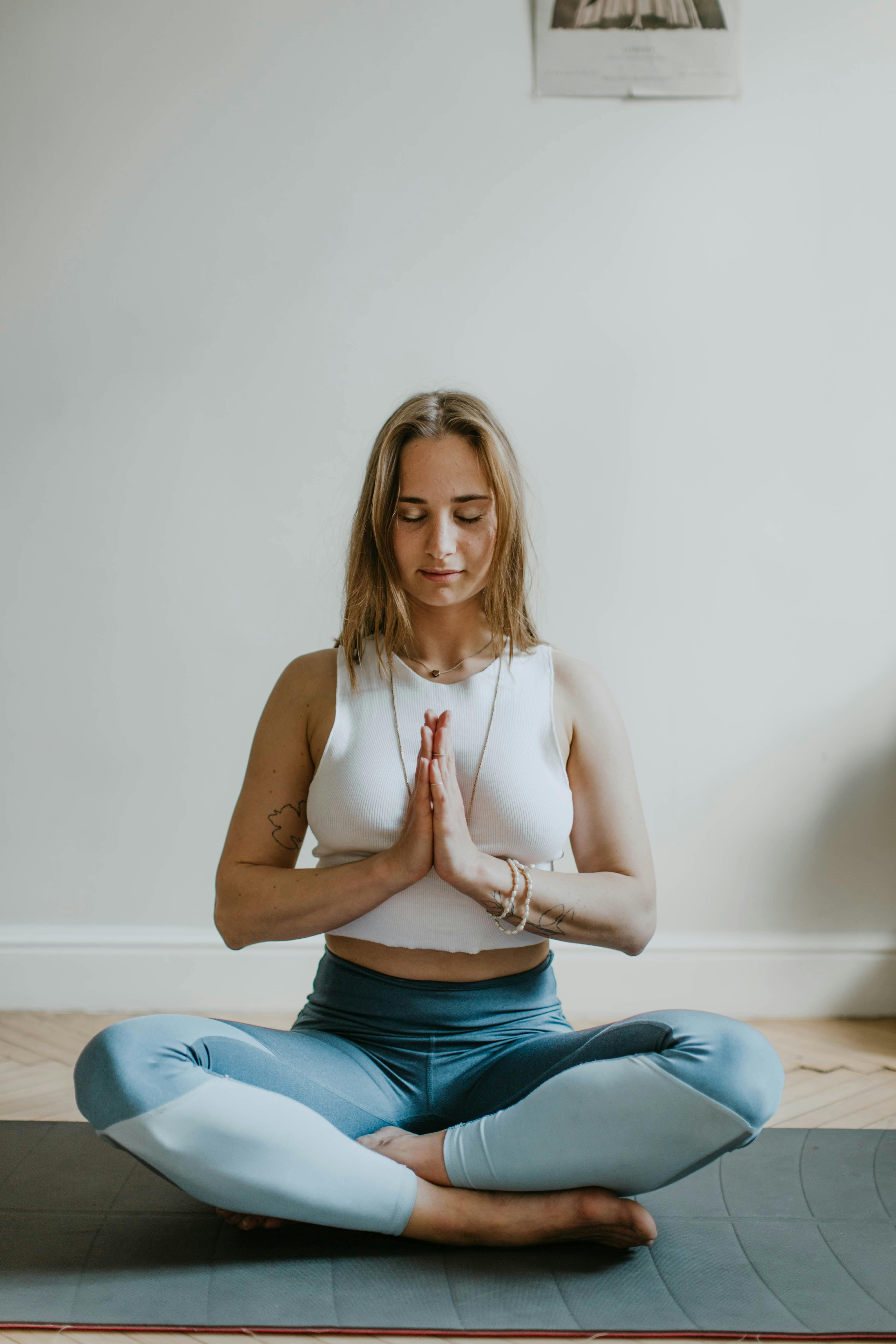 woman doing yoga inside a room