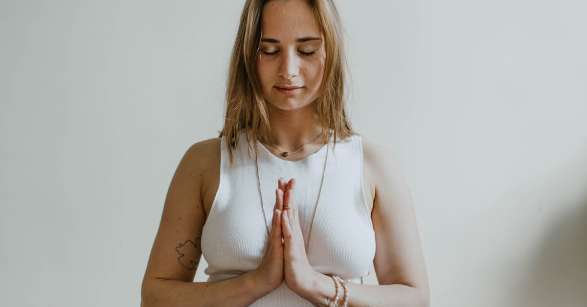A serene image of a woman practicing meditation indoors, promoting mindfulness and wellbeing.