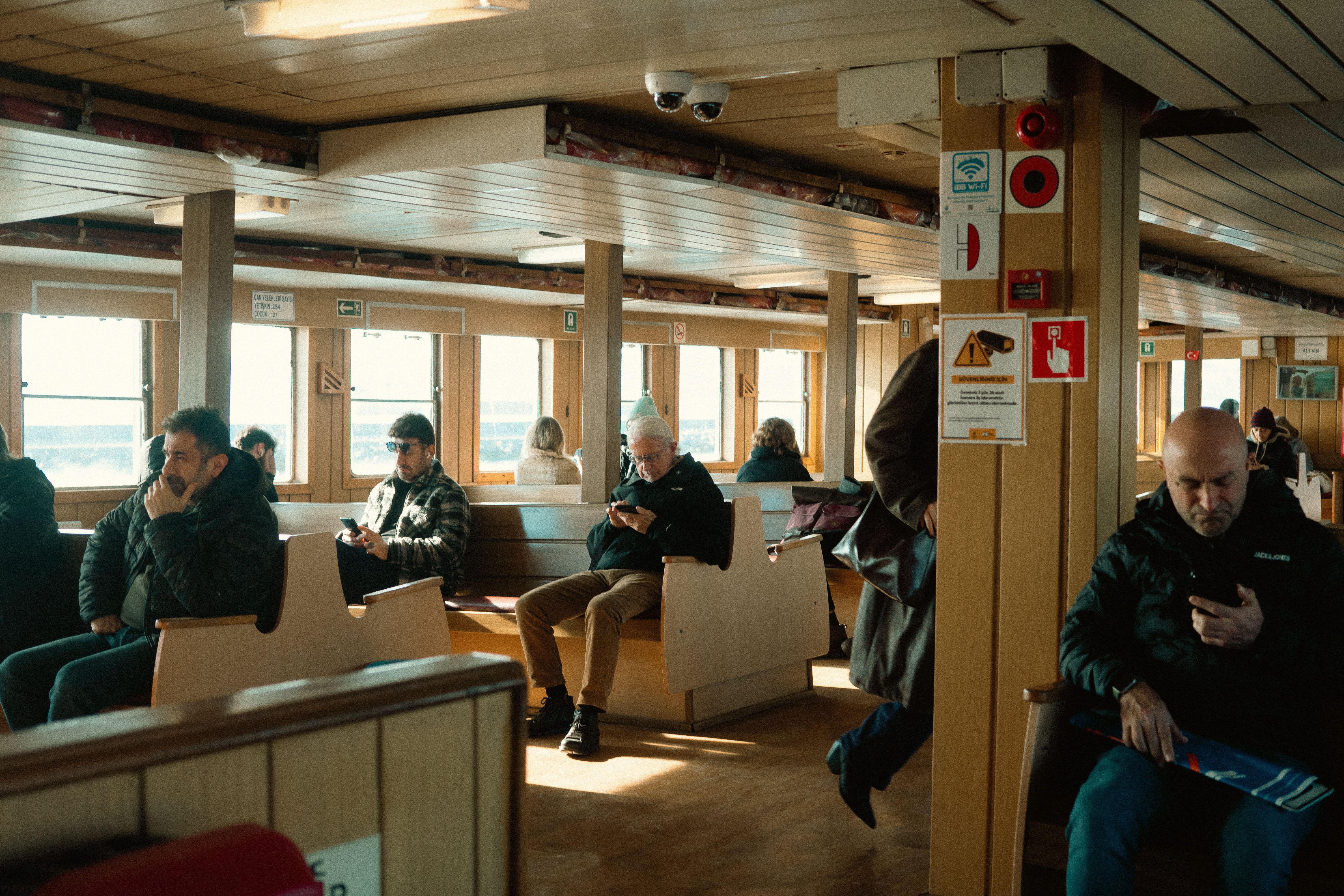 Passengers Relaxing Aboard a Ferry Interior View · Free Stock Photo