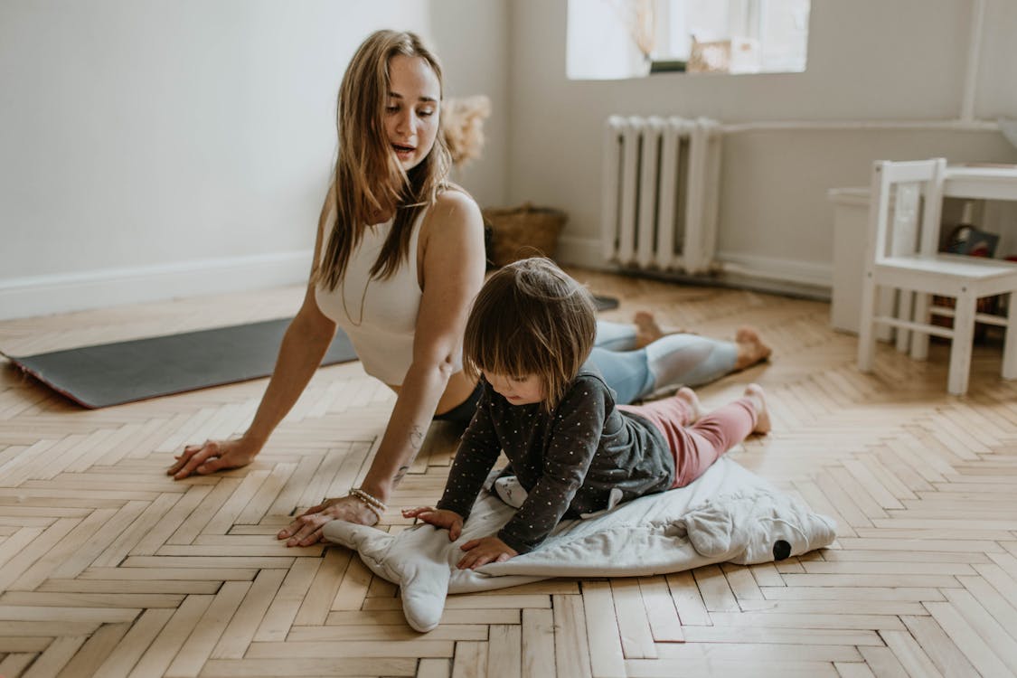 Mother and daughter practising yoga for mindfulness