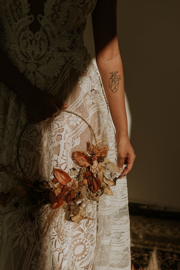  Woman Wearing White Lace Dress Holding Wreath