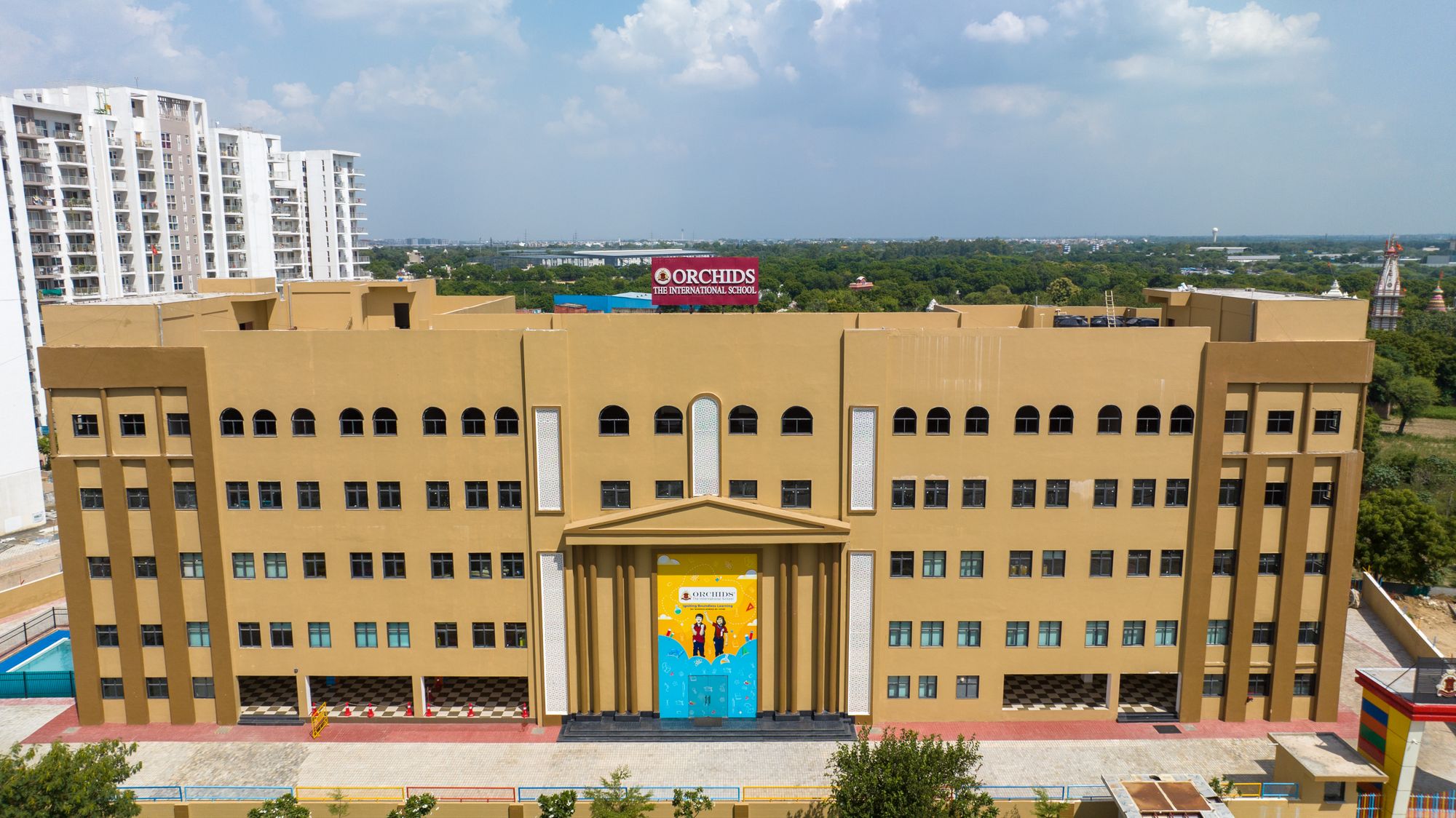 Campus buildings and green grounds of Gurukul Heritage Academy in Jaipur