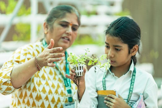 A teacher is instructing a student on plant growth mechanics indoors.